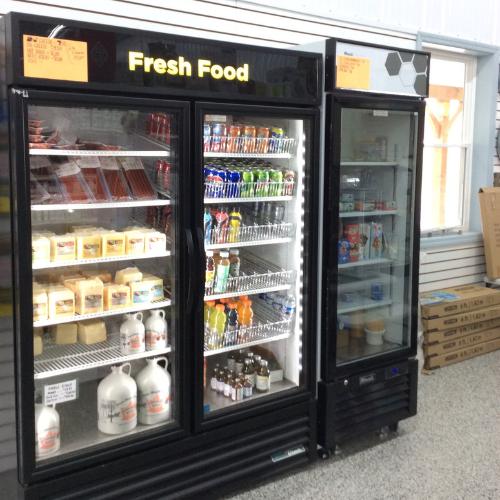 Store display with two glass-door refrigerators labeled 