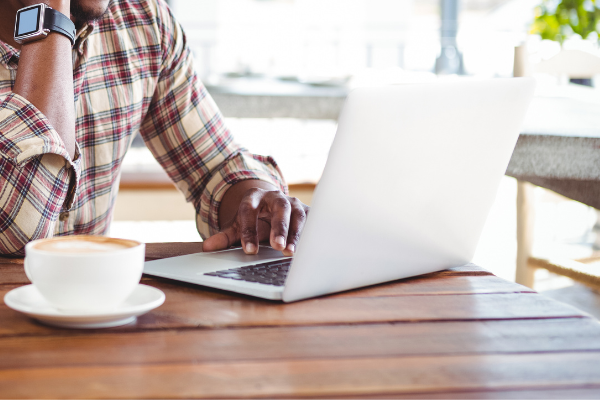 Man typing on laptop